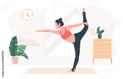 Woman standing in natarajasana exercise