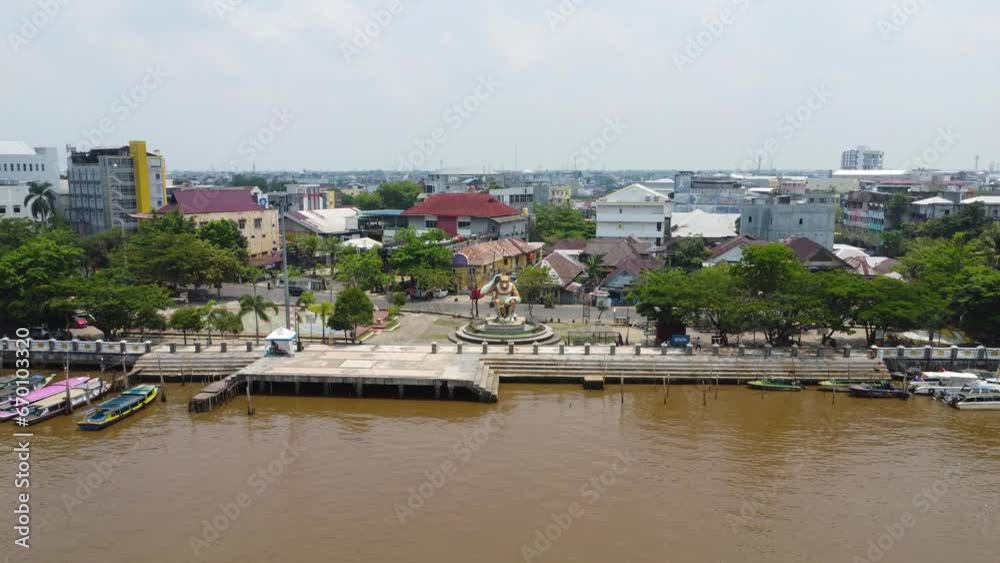 Aerial view of the monkey statue as a typical monument in Banjarmasin in the morning when the weather is foggy due to forest fires Aerial view of the monkey statue as a typical monument in Banjarmasin in the morning when the weather is foggy due to forest fires