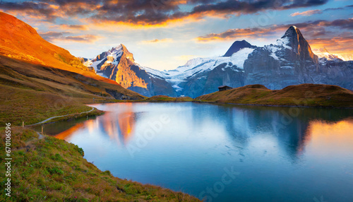 fantastic evening panorama of bachalp lake bachalpsee switzerland picturesque autumn sunset in swiss alps grindelwald bernese oberland europe beauty of nature concept background photo