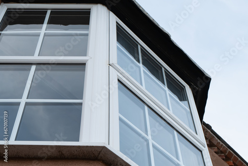 Abstract view of newly installed double glazed windows seen installed in an upper floor bay window.
