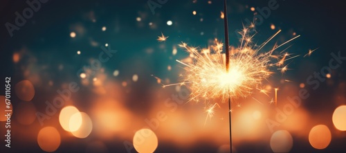 A close-up of a Bengal light on a urban blurred background. Celebration of the new year and Christmas. Party accessory