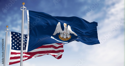 Louisiana state flag waving in the wind with the national flag of the United States