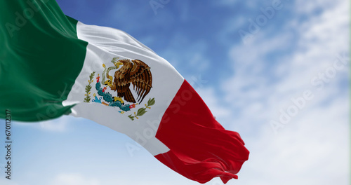 Mexico national flag waving on a clear day photo