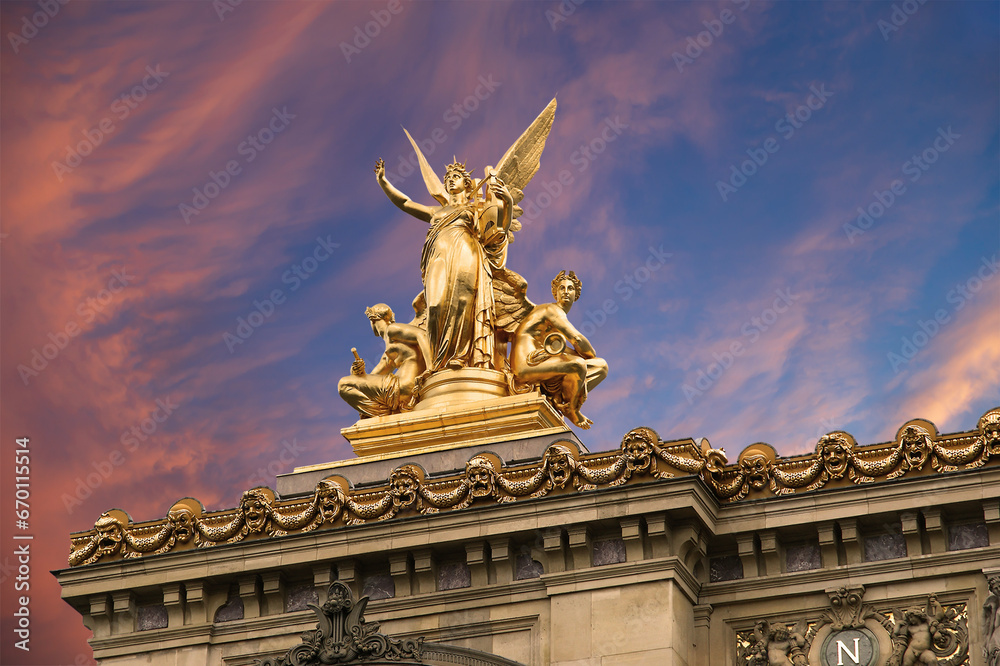 Golden statue of Liberty on the roof of the Opera Garnier (Garnier Palace)  against the sky at sunset. Sculpted by Charles Gumery in 1869. Paris, France. UNESCO World Heritage Site