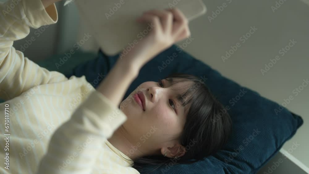 young asian student woman reading a book at college dormitory. young asian student woman reading a book at college dormitory.