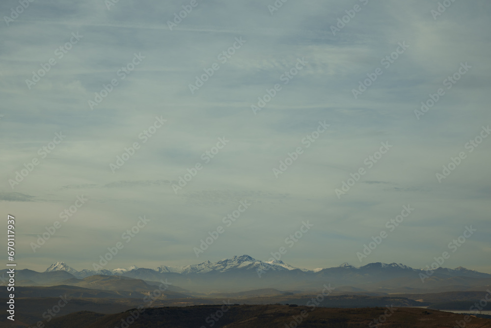 Blue light of the sunset over the snow-covered mountains in Spain