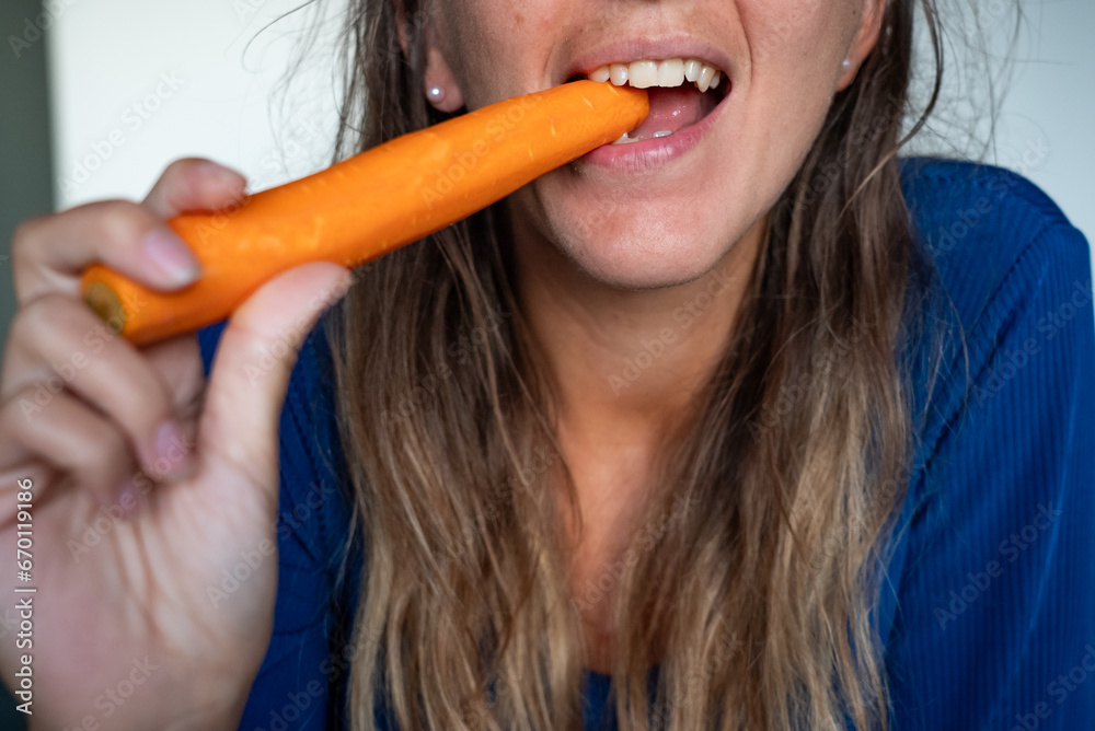 Woman eats food. Woman eats carrot. Close shot of girl eating carrot. Face while eating carrots. Woman eats food. Woman eats carrot. Close shot of girl eating carrot. Face while eating carrots.