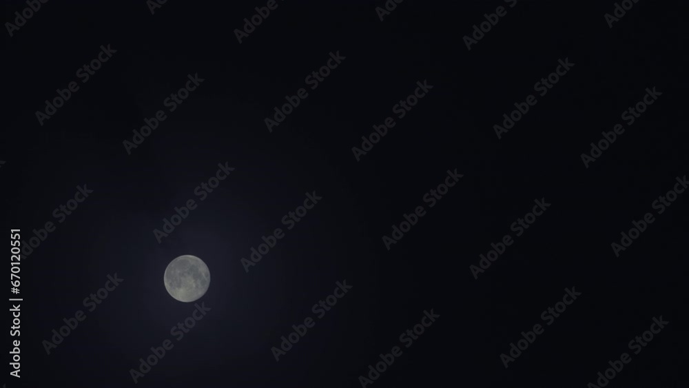 Passage of the moon across a cloudy sky