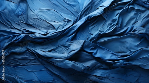 Uma tela de tecido domina o quadro, sua textura uma sinfonia tátil. Um denim azul rico apresenta sua trama familiar, criando colinas e vales de fios. Cada fio é parte da composição maior. photo