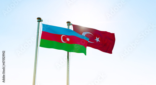 Azerbaijan and Turkey flags waving together on blue sky. 4K ULTRA HD. 