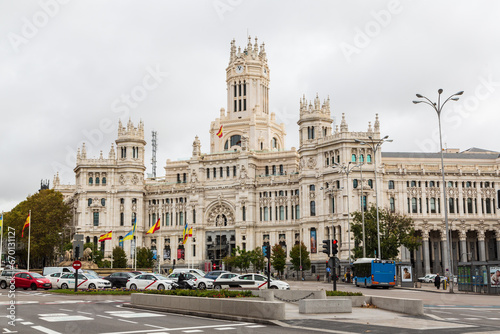 Fototapeta Naklejka Na Ścianę i Meble -  Madrid, Spain - 23 November 2022: City skyline at Cibeles Fountain Town Square and traffic