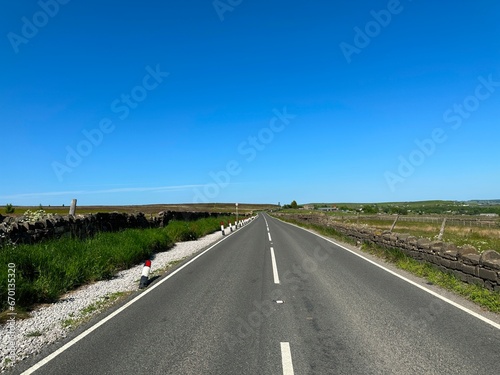 View on, Otley Road, as it crosses the moors, and reservoirs near, Hawksworth, Leeds, UK photo