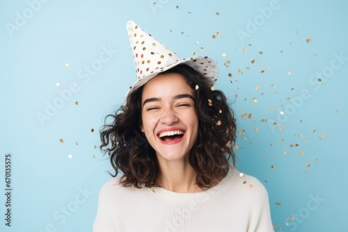 amazed surprising greeting cheerful young adult smiling laug happiness female woman emjoy big exited celebrate with confetti papershoot studio shot on color background portrait shooting photo