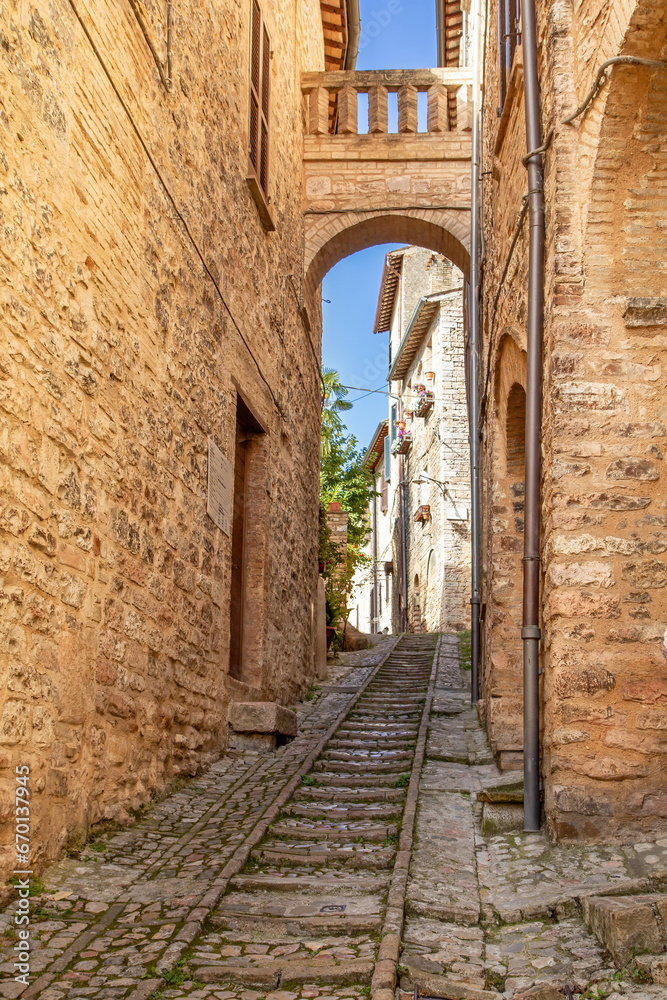 Traditional italian medieval street in the historic center of beautiful little town of Spello, Perugia, Umbria region