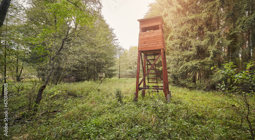 Wooden hunting tower in a forest.
