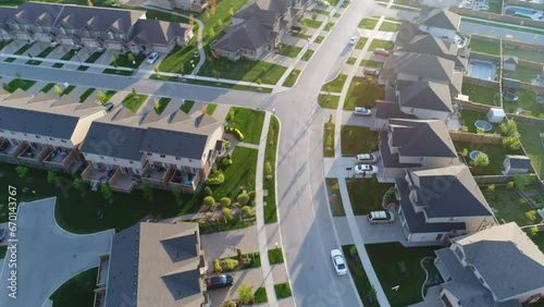 Turning Aerial Over Curved Streets In Upscale Neighborhood photo