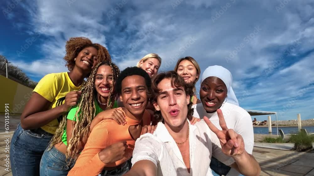 young man with a group of multiracial and multiethnic friends taking selfie oudoors young man with a group of multiracial and multiethnic friends taking selfie oudoors