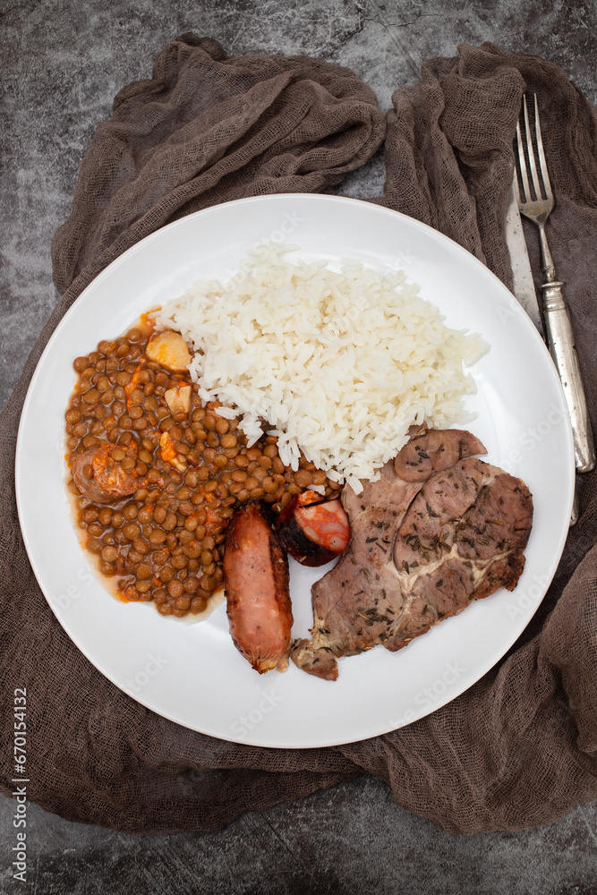 grilled meat, sausage, lentils and boiled rice grilled meat, sausage, lentils and boiled rice