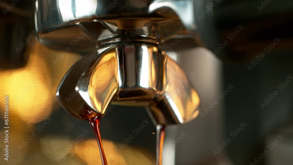 Close-up Slow Motion of Espresso Pouring from Coffee Machine. Filmed on High Speed Cinematic Camera at 1000 fps. Close-up Slow Motion of Espresso Pouring from Coffee Machine. Filmed on High Speed Cinematic Camera at 1000 fps.