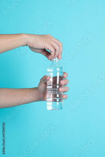 Holding plastic bottle