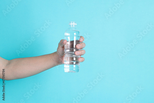 Holding plastic bottle