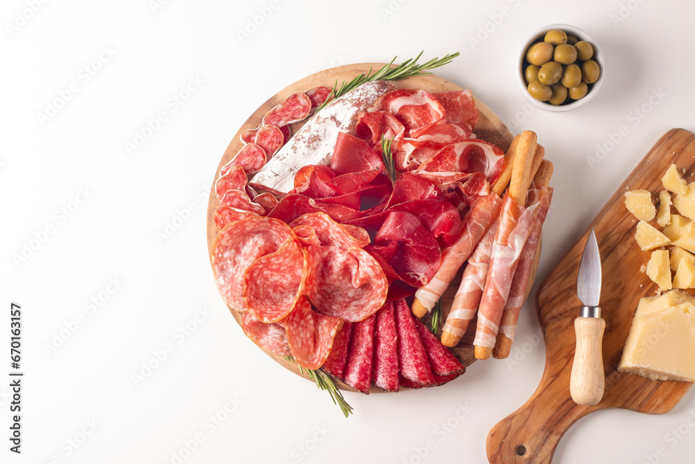 Obraz premium Charcuterie board. Antipasti appetizers of meat platter with salami, prosciutto crudo or jamon and olives