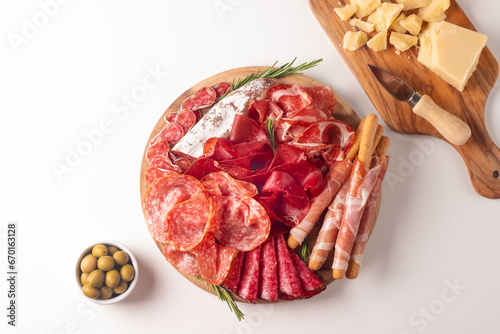 Charcuterie board. Antipasti appetizers of meat platter with salami, prosciutto crudo or jamon and olives