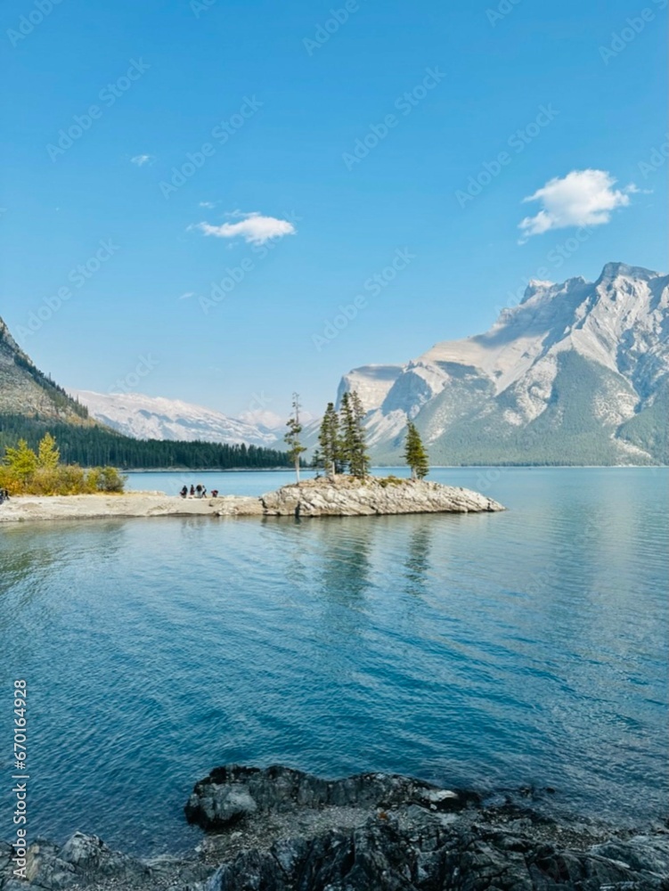 Banff national park, Canada. 18.10.2023. Scenic autumn mountains landscape against beautiful river. Rocky mountains in Alberta. Travel in fall.