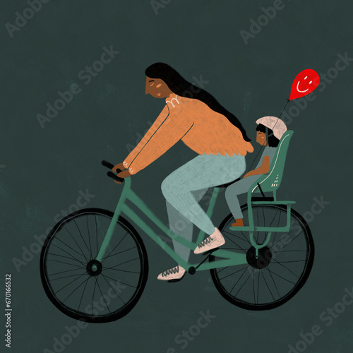 Woman cycling with child and balloon photo