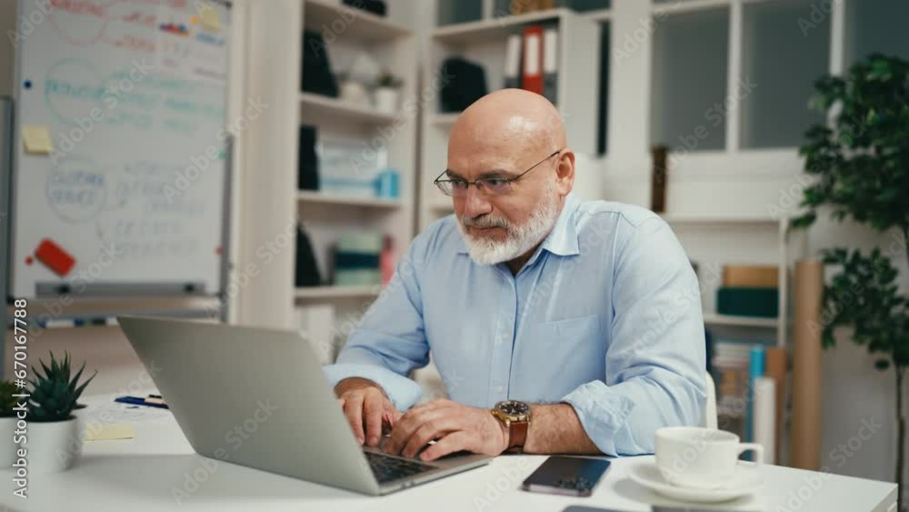 Middle-aged businessman getting email with good news, positive day, success Middle-aged businessman getting email with good news, positive day, success