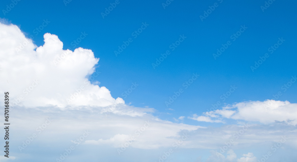 Obraz premium Blue sky and white clouds. Wide photo.