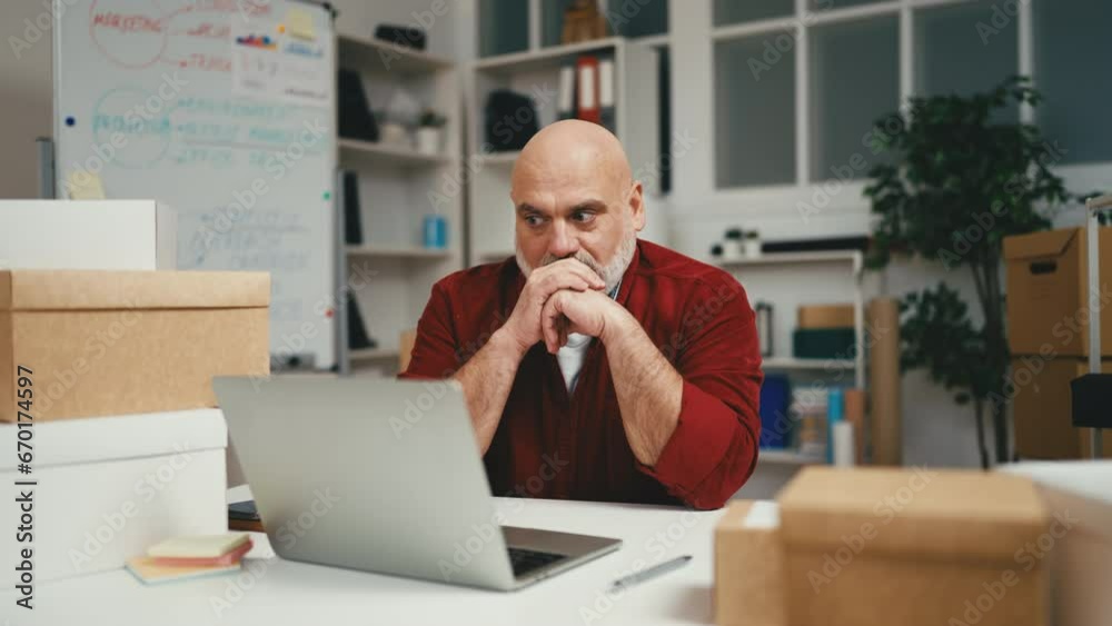 Male small business owner feeling exhaustion at work, getting bad news, problems