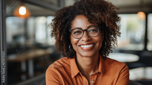 Portrait of smiling senior african american woman in eyeglasses outdoors.