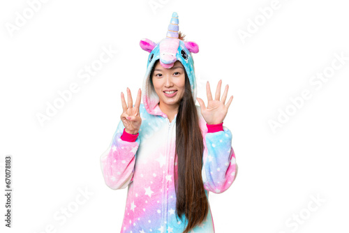 Young Asian woman with unicorn pajamas over isolated chroma key background counting eight with fingers