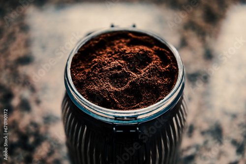Ground coffee in ribbed jar
