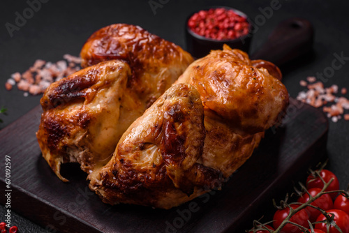 Crispy delicious whole baked chicken with vegetables, salt and spices