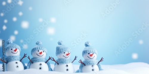 A group of snowmen standing in the snow. This picture can be used for winter-themed designs and holiday greetings.
