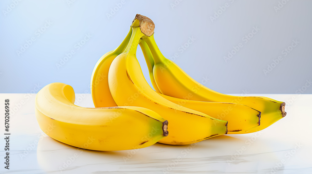 Bunches of bananas sitting next to each other on white surface. Bunches of bananas sitting next to each other on white surface.
