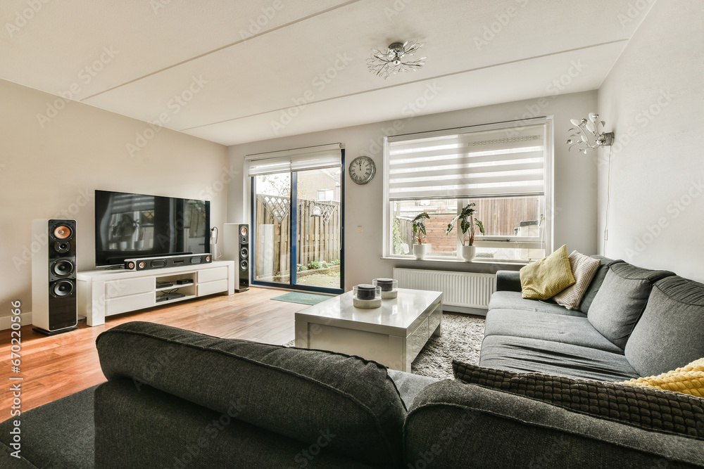Living room with furniture and television by window
