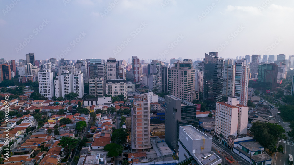 Residential buildings and houses in the Itaim Bibi neighborhood in São Paulo, Brazil. Aerial view of Ibirapuera Park with buildings in the background.