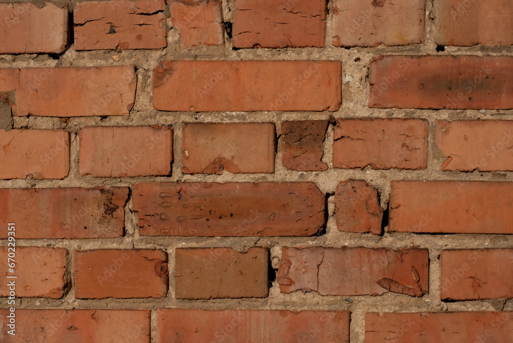 Obraz premium Old-aged brick wall grunge texture pattern. Red brick background. Brick tiles facade.