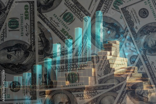 Billetes de 100 dólares con un gráfico de barras mostrando crecimiento económico y lingotes de oro photo