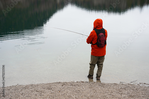 person fishing on the lake