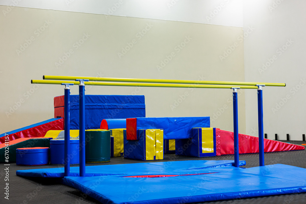 Dynamic Gym Setup for Kids: Colorful and Safe Equipment for Active Playtime.