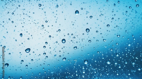 Water and rain drops on the glass  abstract view  Drops of rain on blue glass background   drops on glass after rain