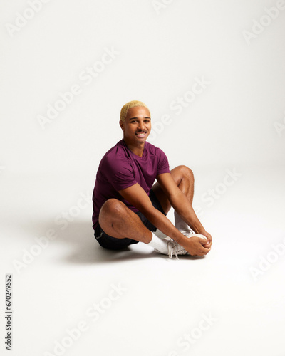 SPORTS MAN STRETCHING HAPPY AND FIT