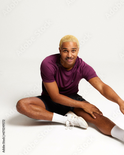 SPORTS MAN STRETCHING HAPPY AND FIT