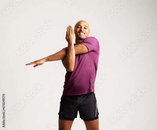 SPORTS MAN STRETCHING HAPPY AND FIT
