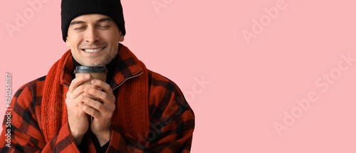 Happy young man in winter c...