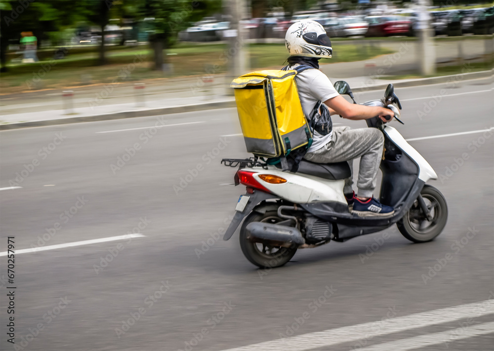 Abstract blur image of scooter courier